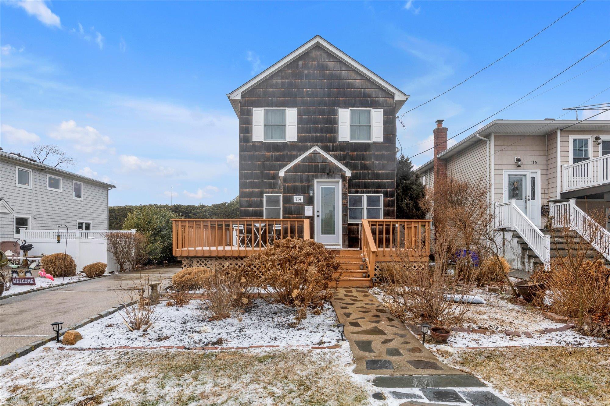 114 N Road Babylon, NY 11702 - Photo 1 of 1 View of front property featuring a wooden deck
