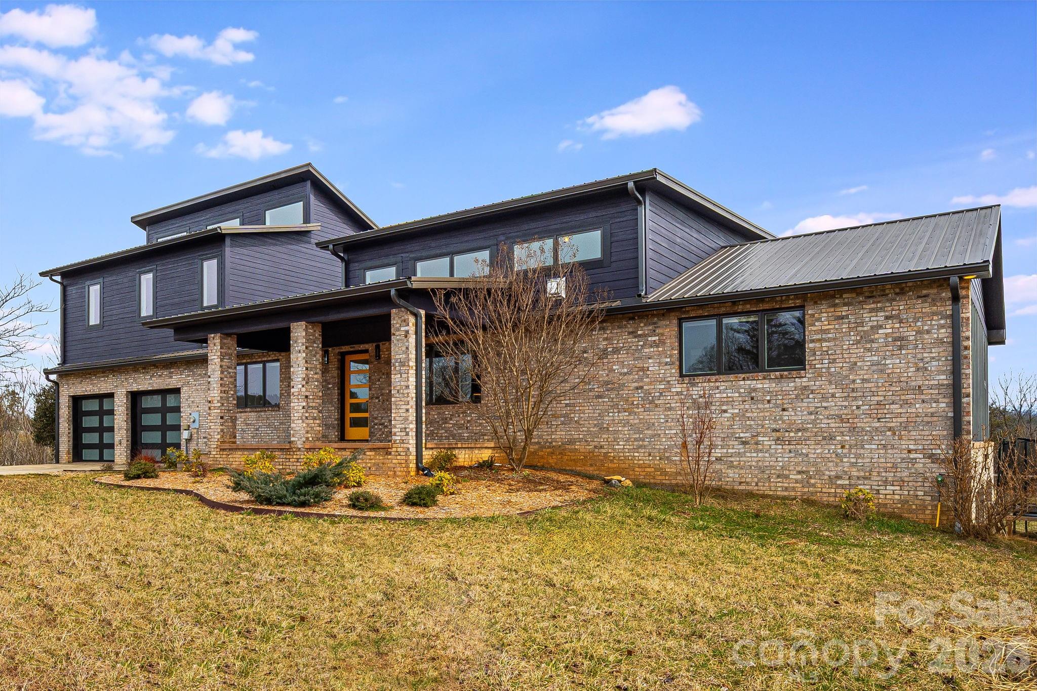 a front view of a house with yard