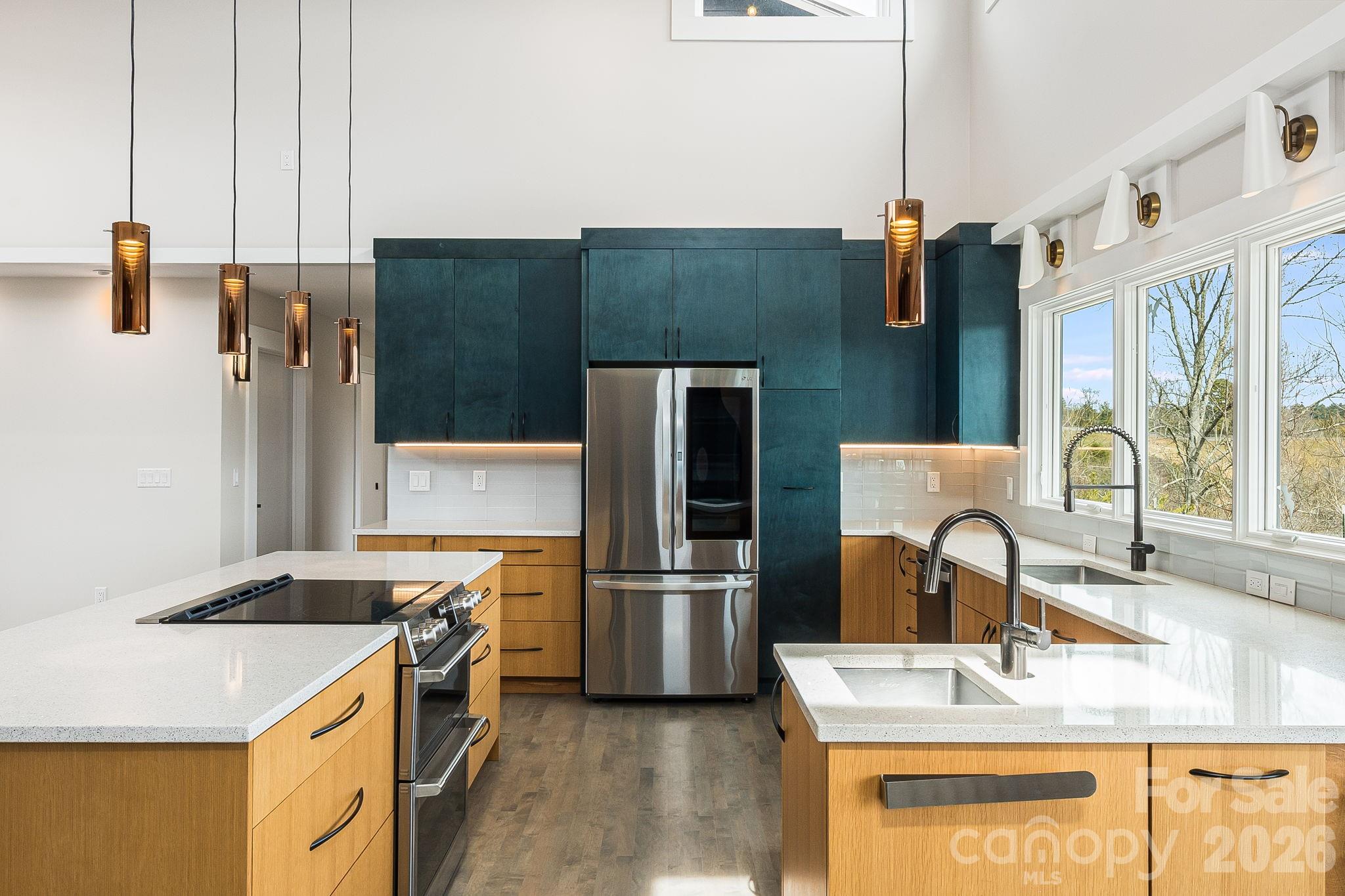 76 Murray De Bruhl Road Alexander, NC 28701 - Photo 12 of 44 a kitchen with stainless steel appliances granite countertop a sink stove and refrigerator