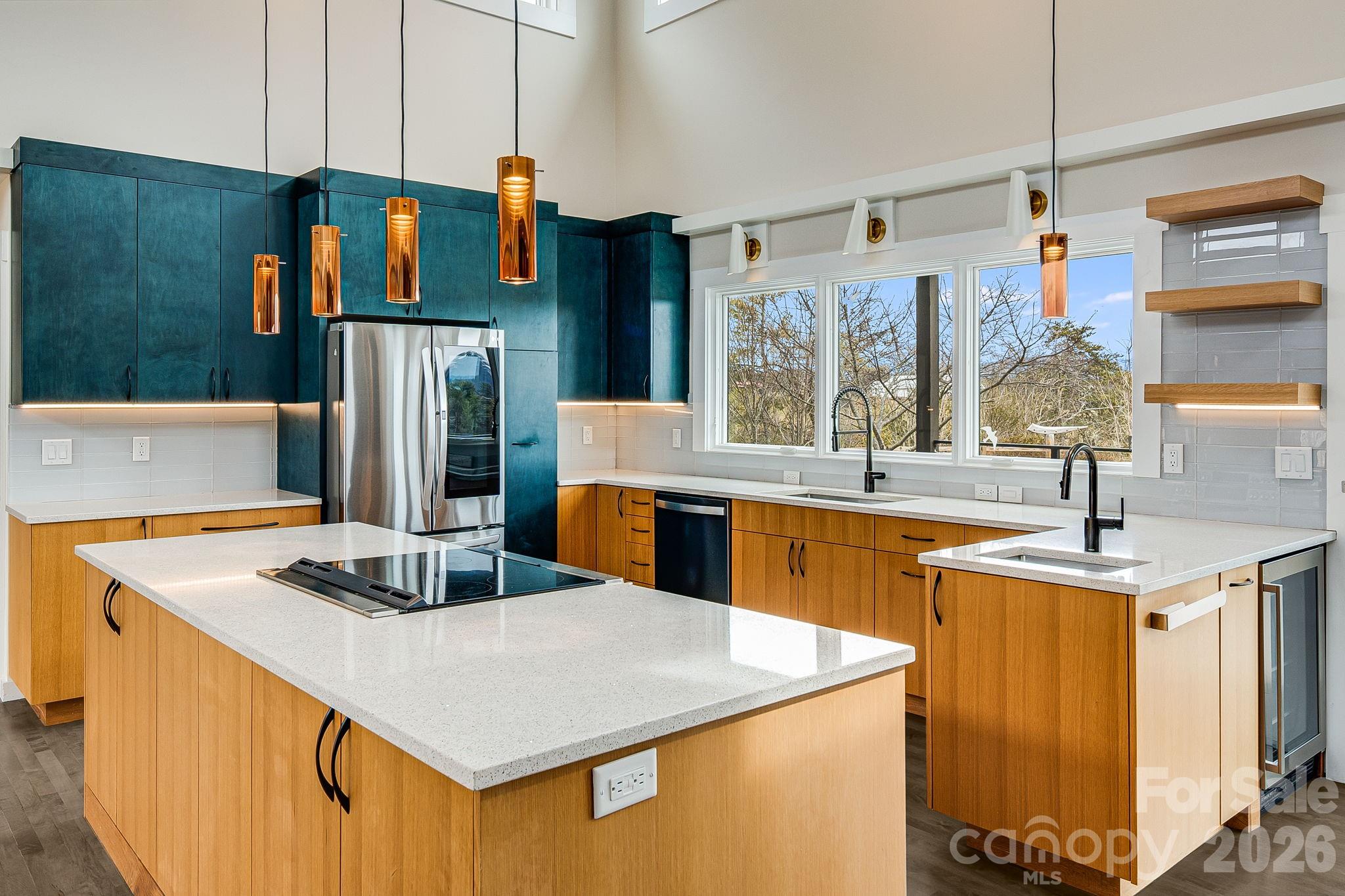 76 Murray De Bruhl Road Alexander, NC 28701 - Photo 13 of 44 a kitchen with stainless steel appliances granite countertop a sink and a refrigerator