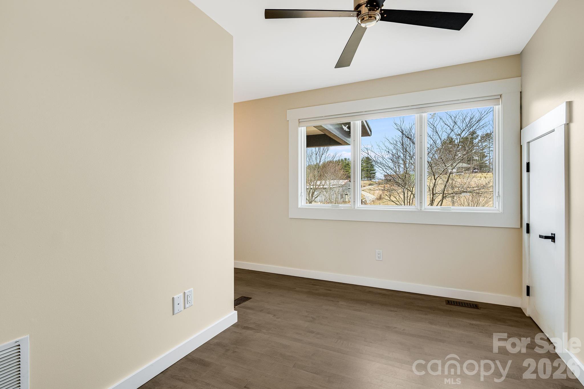 76 Murray De Bruhl Road Alexander, NC 28701 - Photo 20 of 44 a view of an empty room with a window