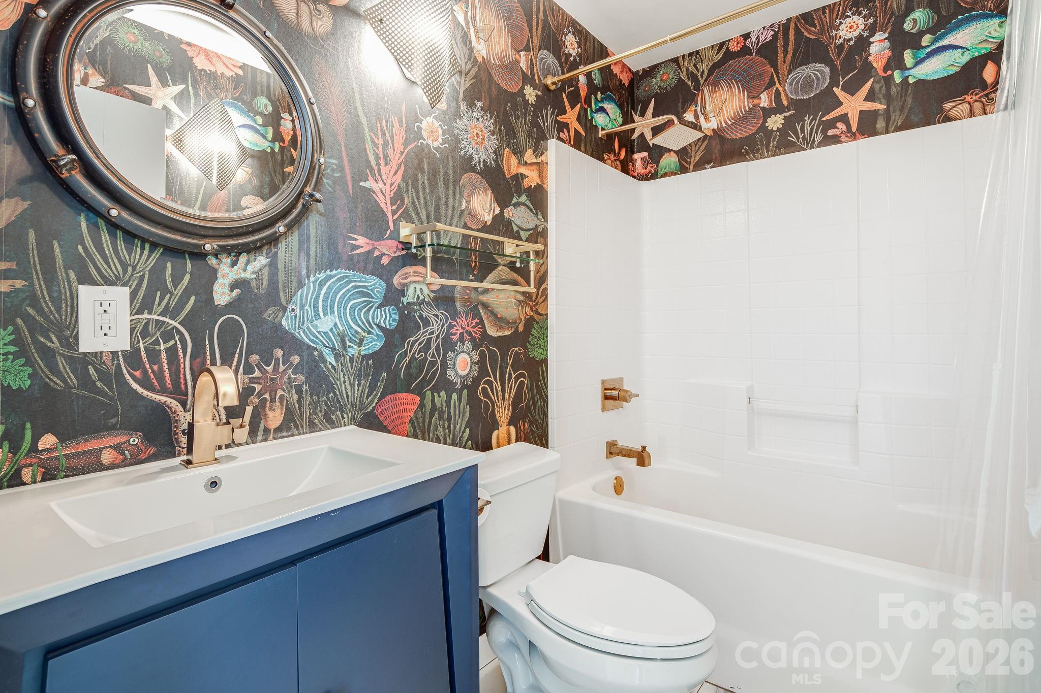 76 Murray De Bruhl Road Alexander, NC 28701 - Photo 21 of 44 a bathroom with a toilet a sink and a bathtub