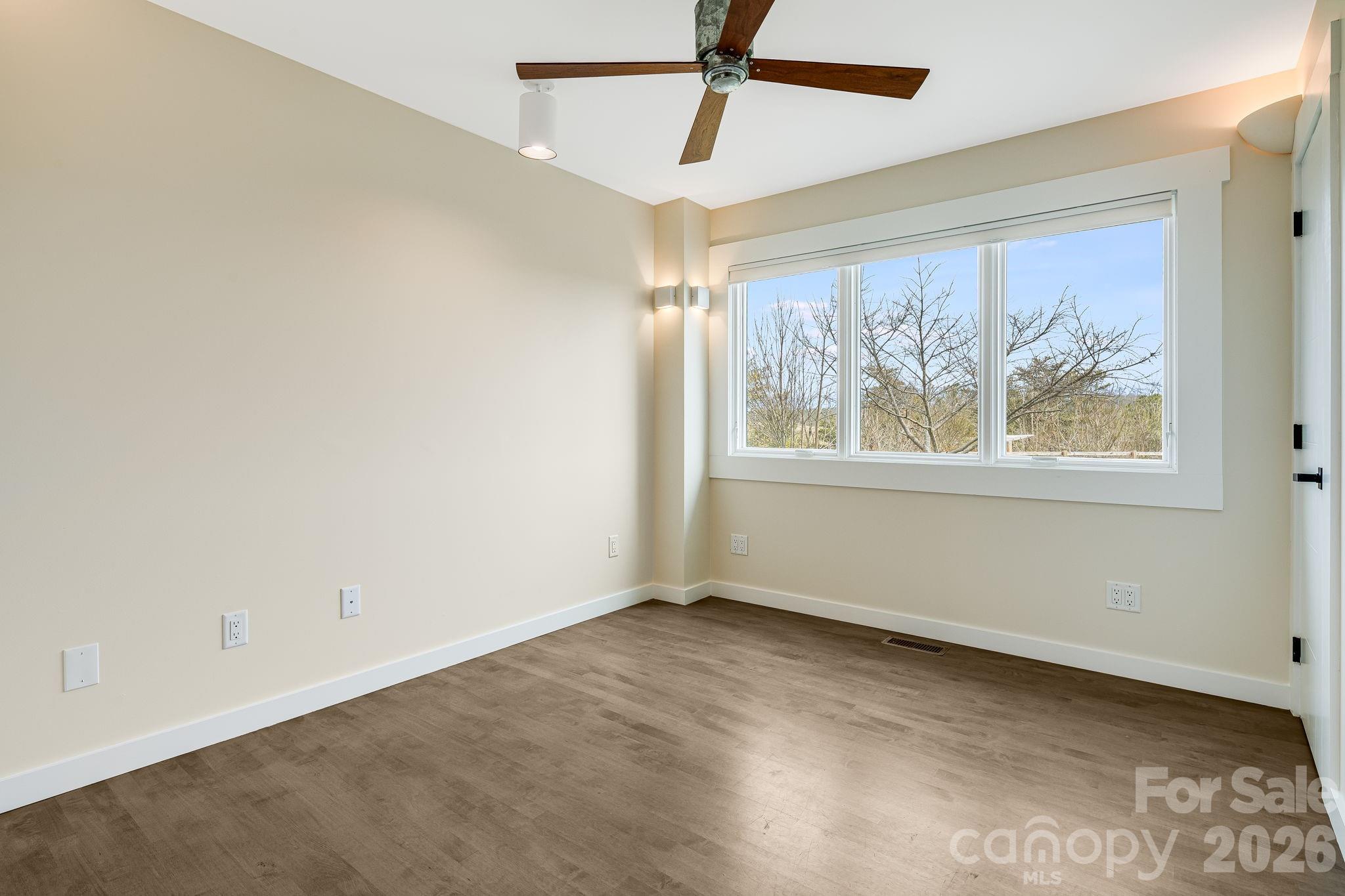 76 Murray De Bruhl Road Alexander, NC 28701 - Photo 22 of 44 a view of an empty room with a window