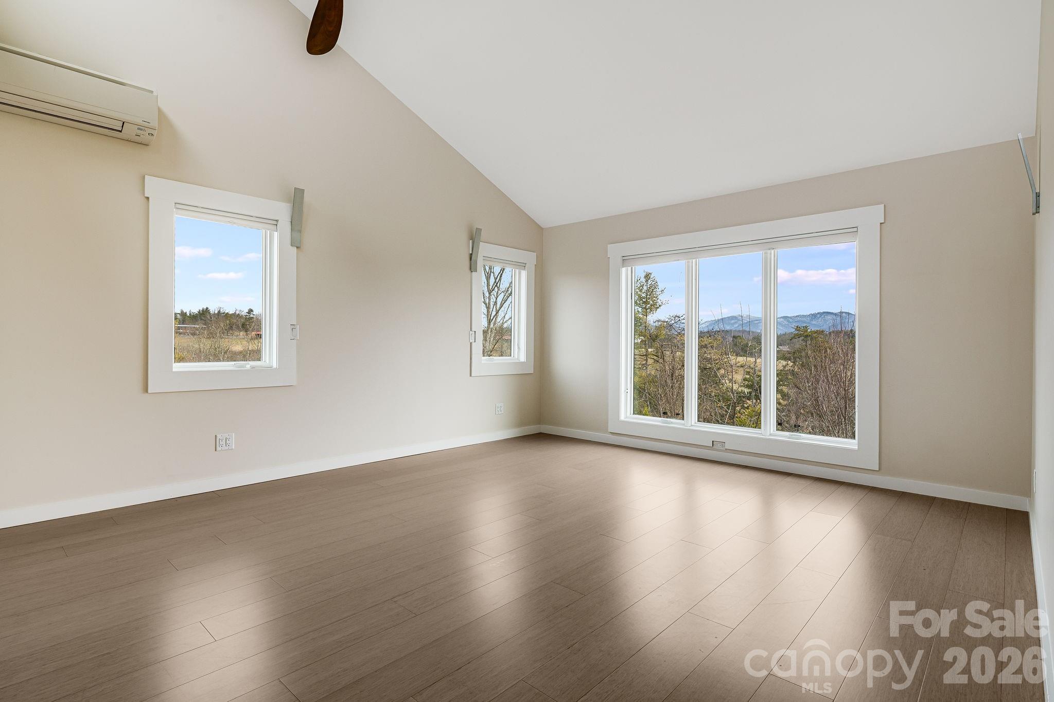 76 Murray De Bruhl Road Alexander, NC 28701 - Photo 25 of 44 a view of an empty room with wooden floor and a window