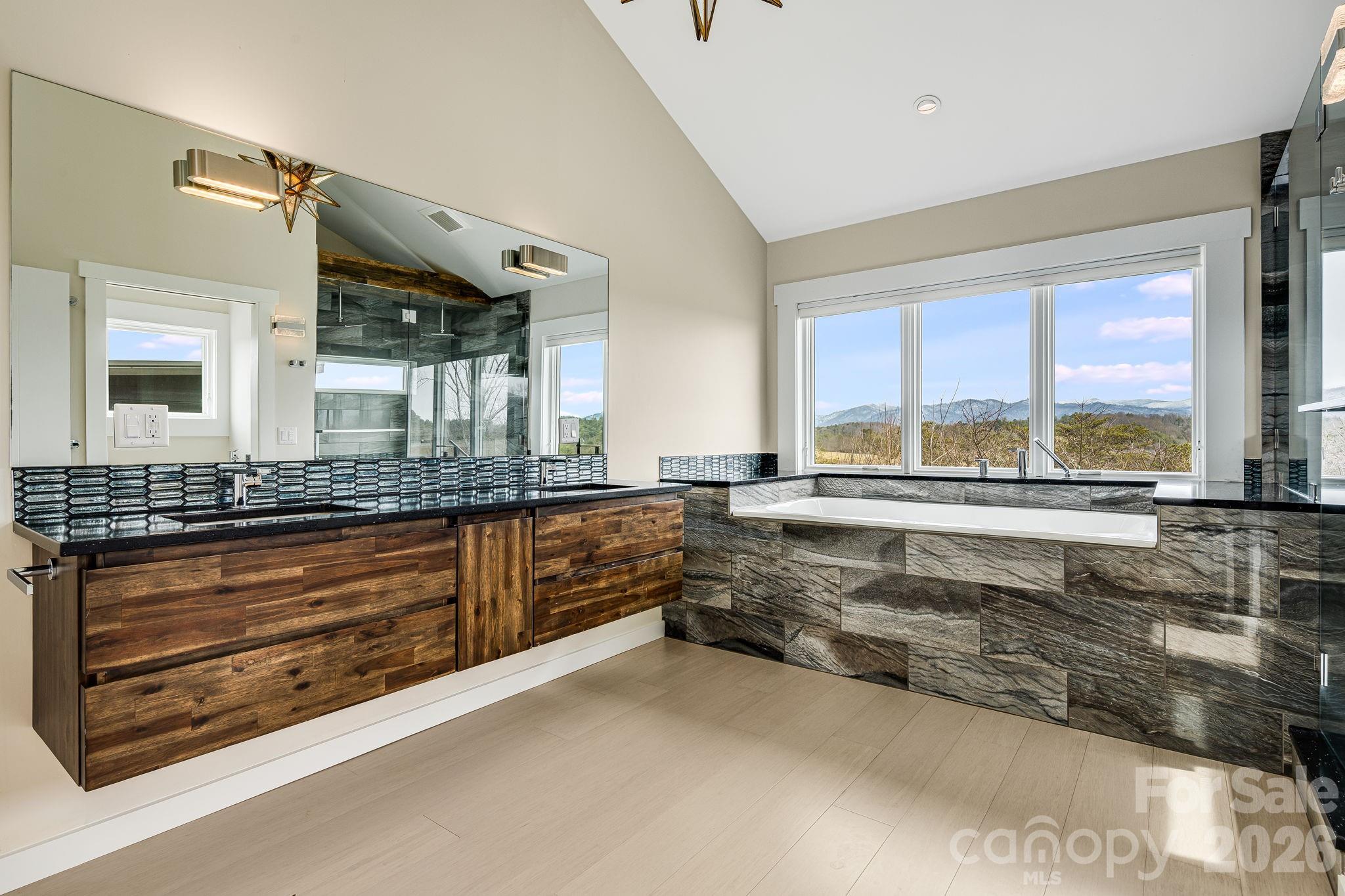 76 Murray De Bruhl Road Alexander, NC 28701 - Photo 27 of 44 a large bathroom with a large tub and sink