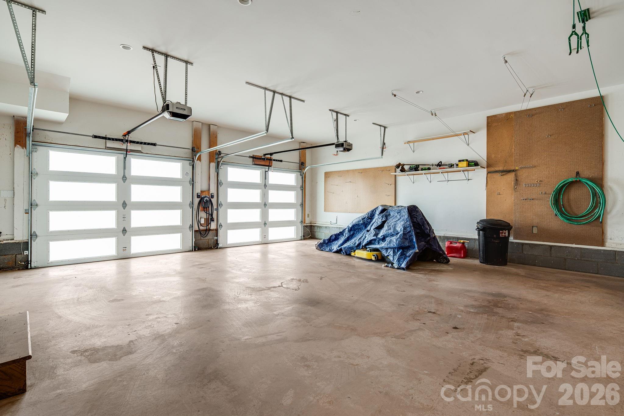 76 Murray De Bruhl Road Alexander, NC 28701 - Photo 30 of 44 a view of a garage with furniture and a window