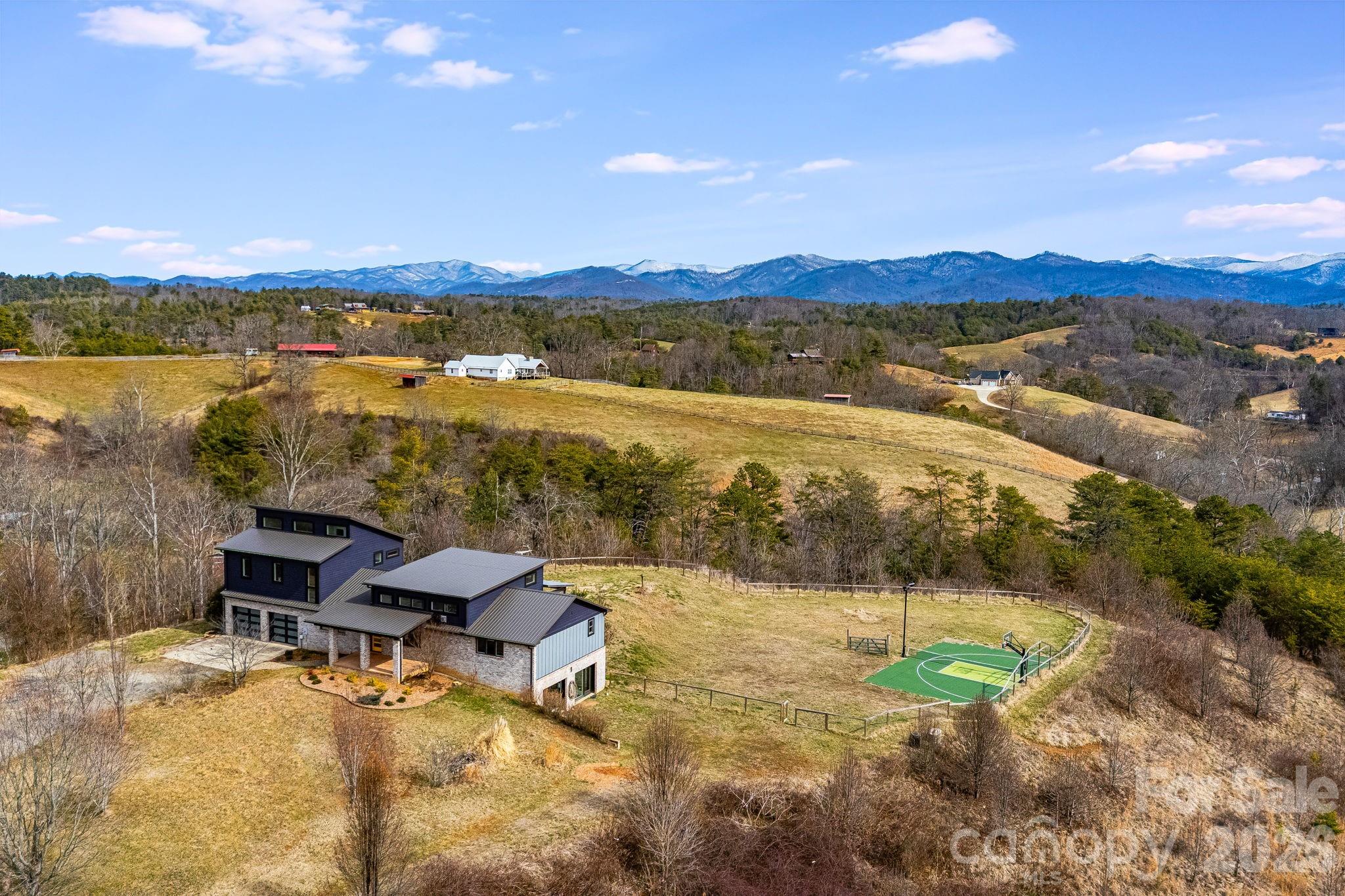 76 Murray De Bruhl Road Alexander, NC 28701 - Photo 3 of 44 a view of a lake with a mountain in the background