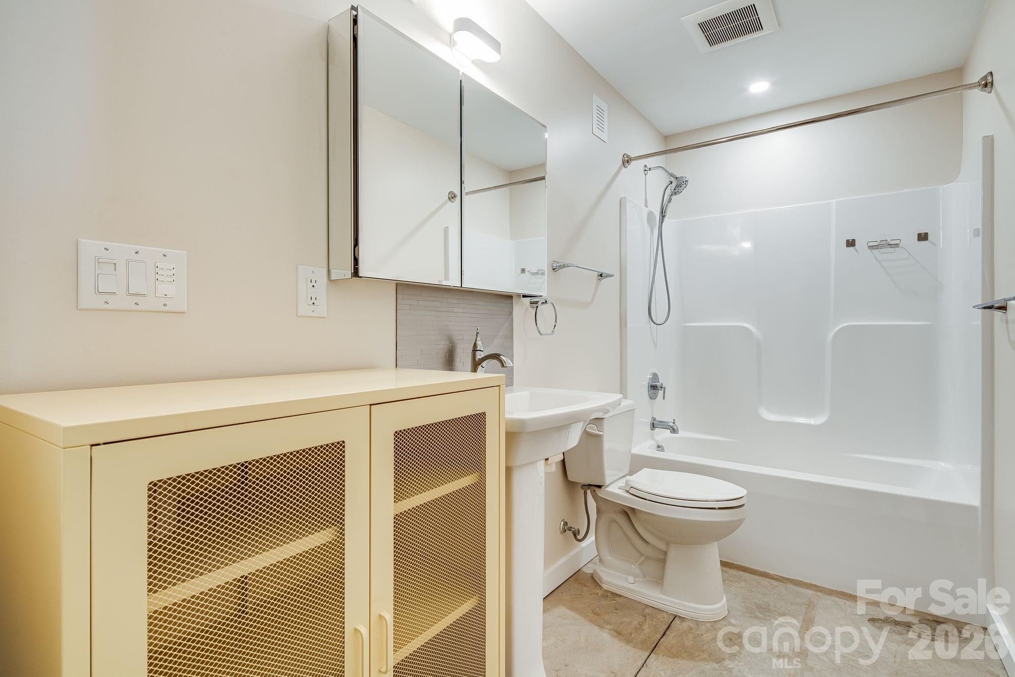 76 Murray De Bruhl Road Alexander, NC 28701 - Photo 32 of 44 a bathroom with a sink toilet and shower