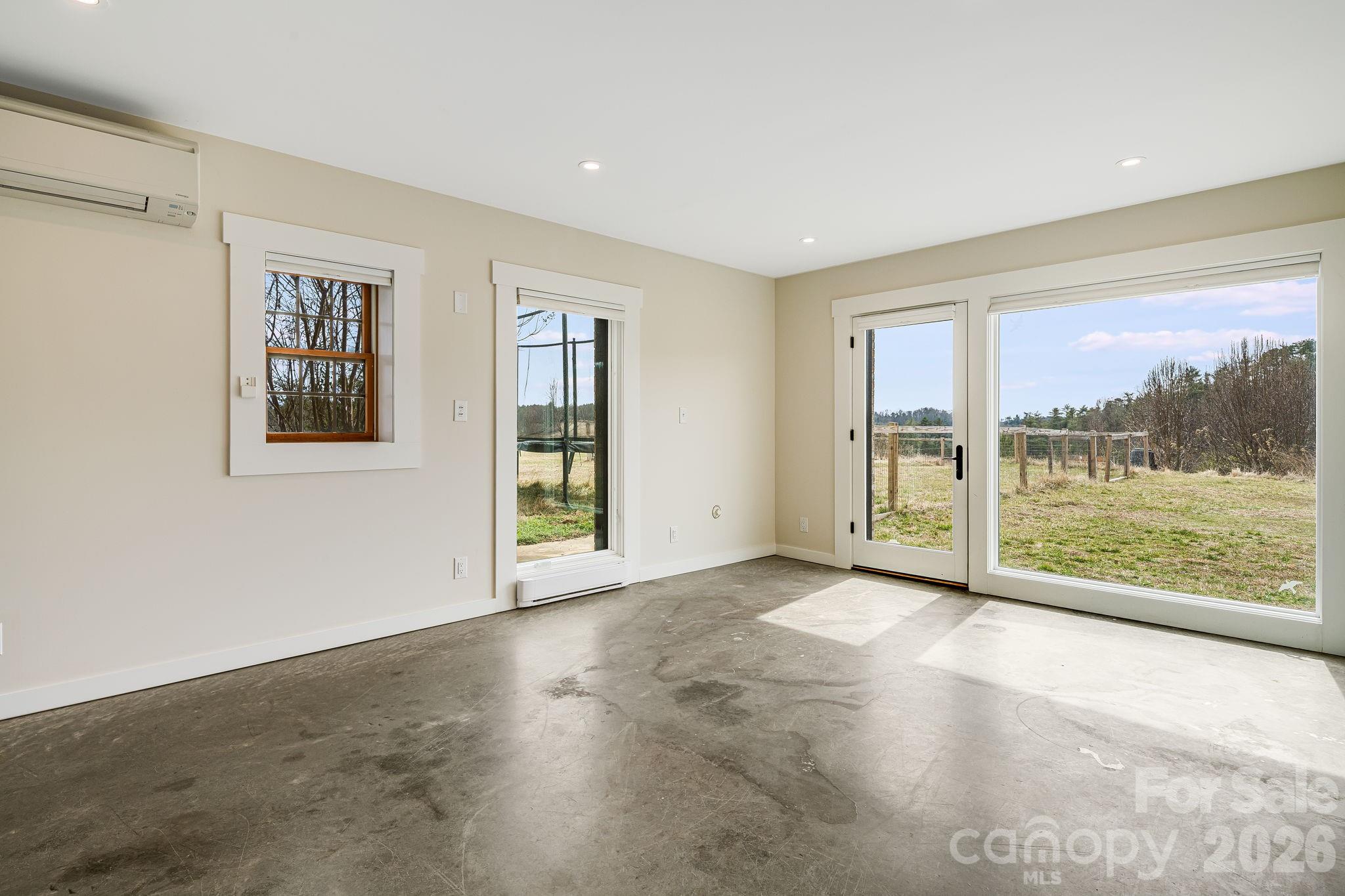 76 Murray De Bruhl Road Alexander, NC 28701 - Photo 37 of 44 a view of an empty room with a window