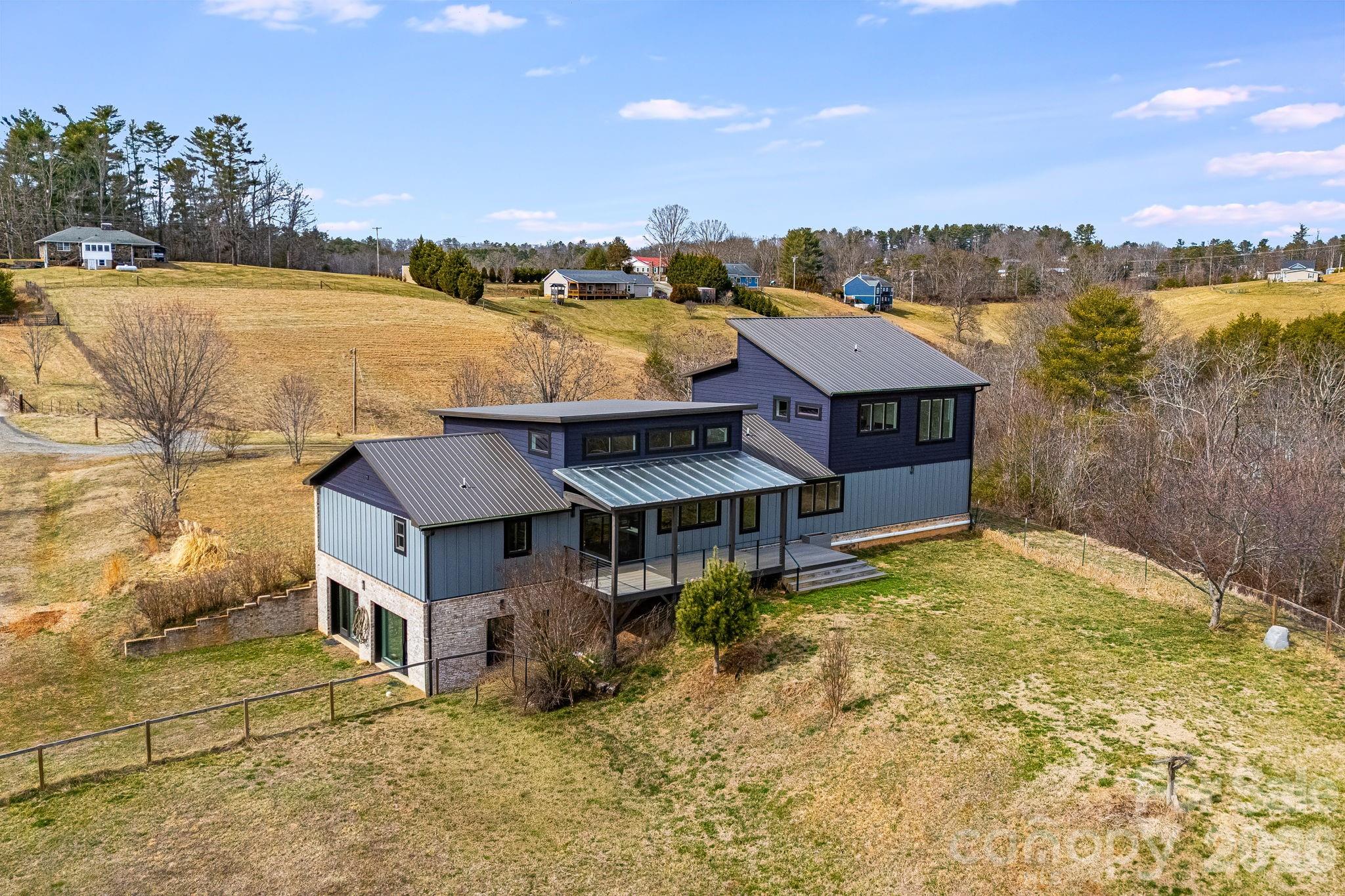 76 Murray De Bruhl Road Alexander, NC 28701 - Photo 4 of 44 a aerial view of a house with a ocean view