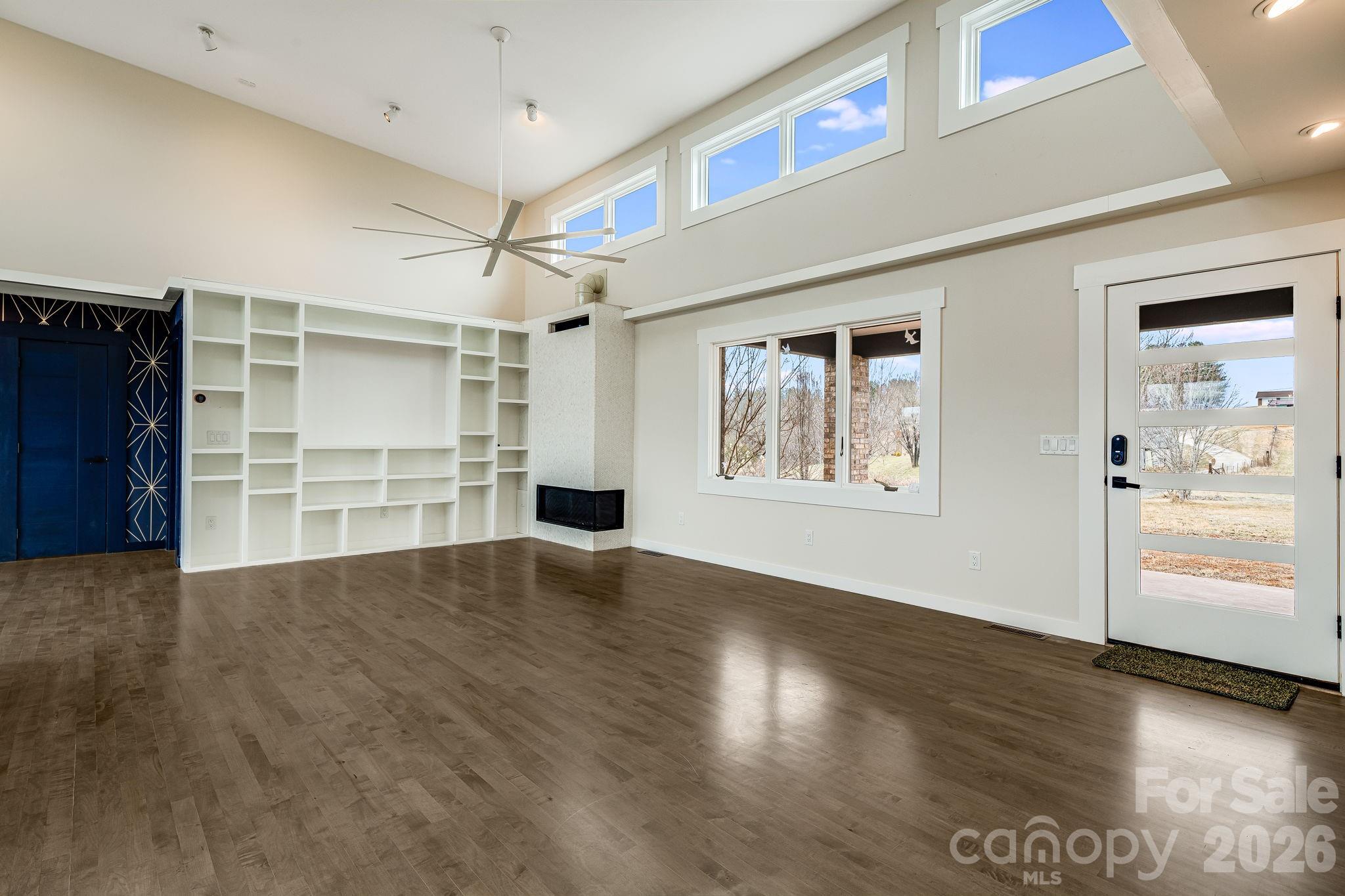 76 Murray De Bruhl Road Alexander, NC 28701 - Photo 7 of 44 an empty space with wooden floor and windows