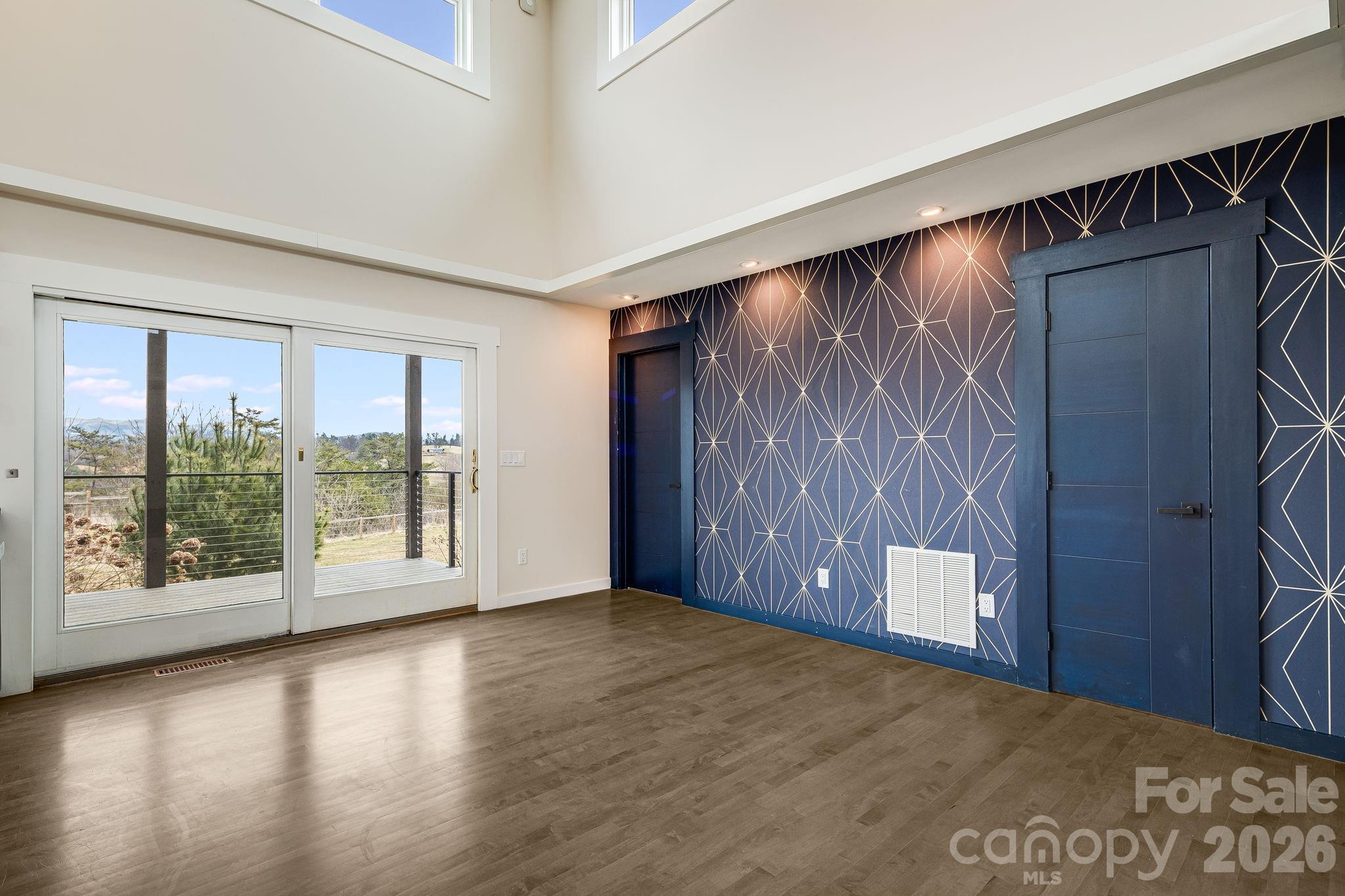 76 Murray De Bruhl Road Alexander, NC 28701 - Photo 9 of 44 a view of livingroom with furniture and floor to ceiling window