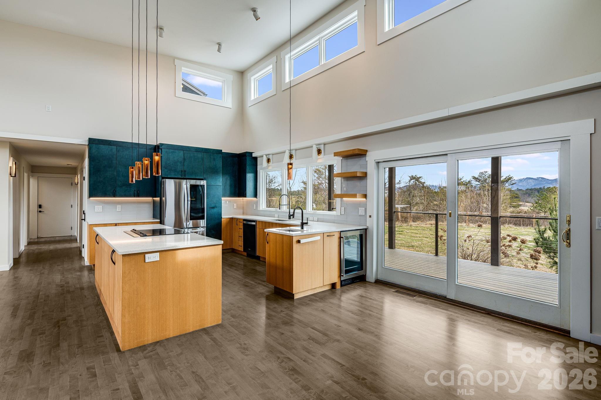 76 Murray De Bruhl Road Alexander, NC 28701 - Photo 10 of 44 a kitchen that has a lot of cabinets in it