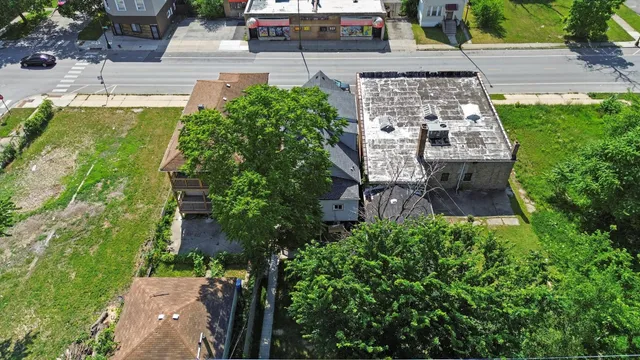 an aerial view of a house with a garden
