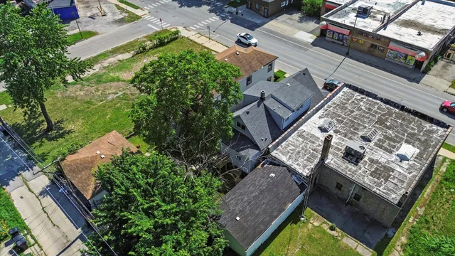 an aerial view of house with yard