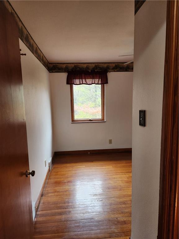 5330 Greensburg Road Apollo, PA 15613 - Photo 23 of 39 an empty room with wooden floor and windows