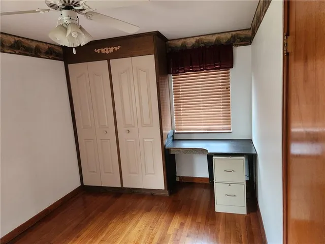 a room with window and wooden floor