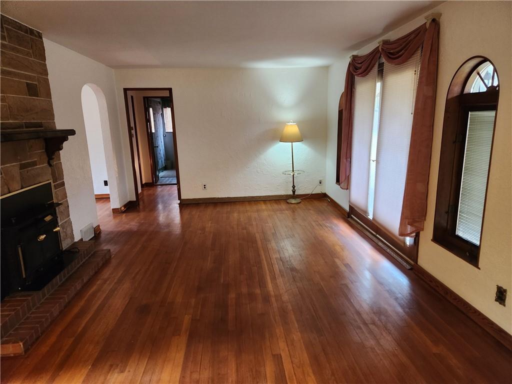 5330 Greensburg Road Apollo, PA 15613 - Photo 5 of 39 wooden floor in an empty room with a fireplace