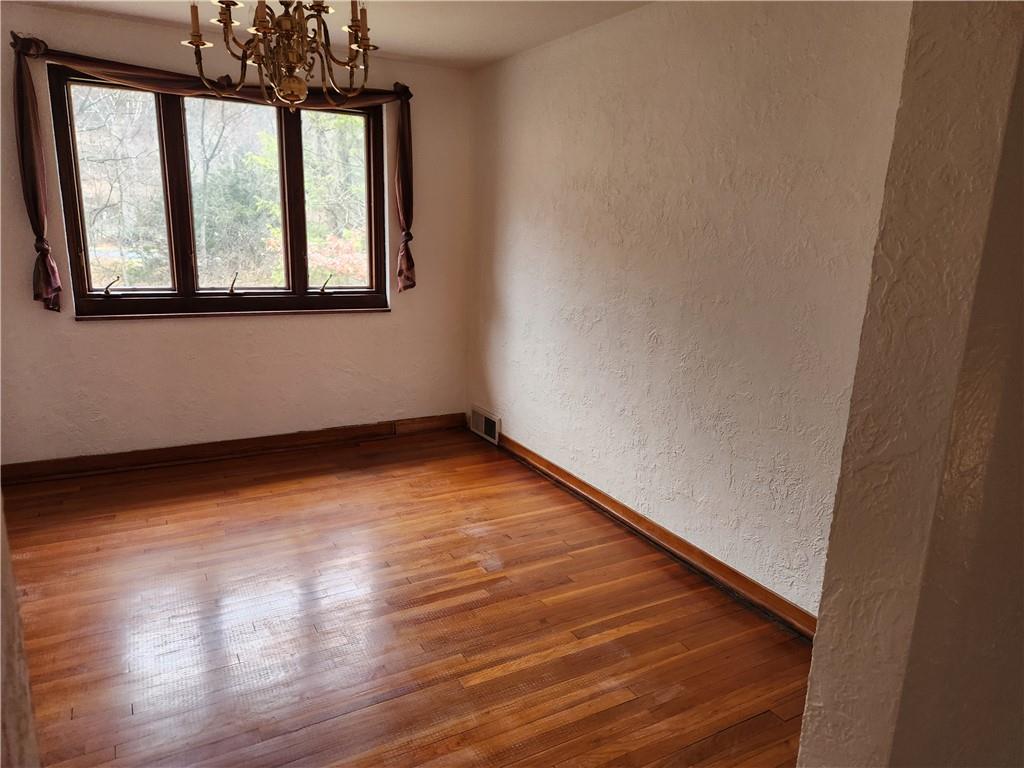 5330 Greensburg Road Apollo, PA 15613 - Photo 9 of 39 a view of empty room with wooden floor and fan