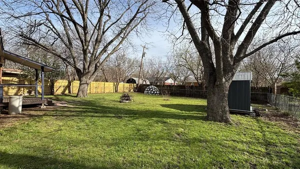 a view of a park with large trees