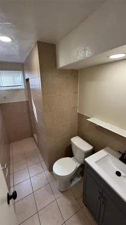 a bathroom with a toilet and a sink