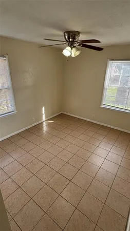 a view of an empty room and a window