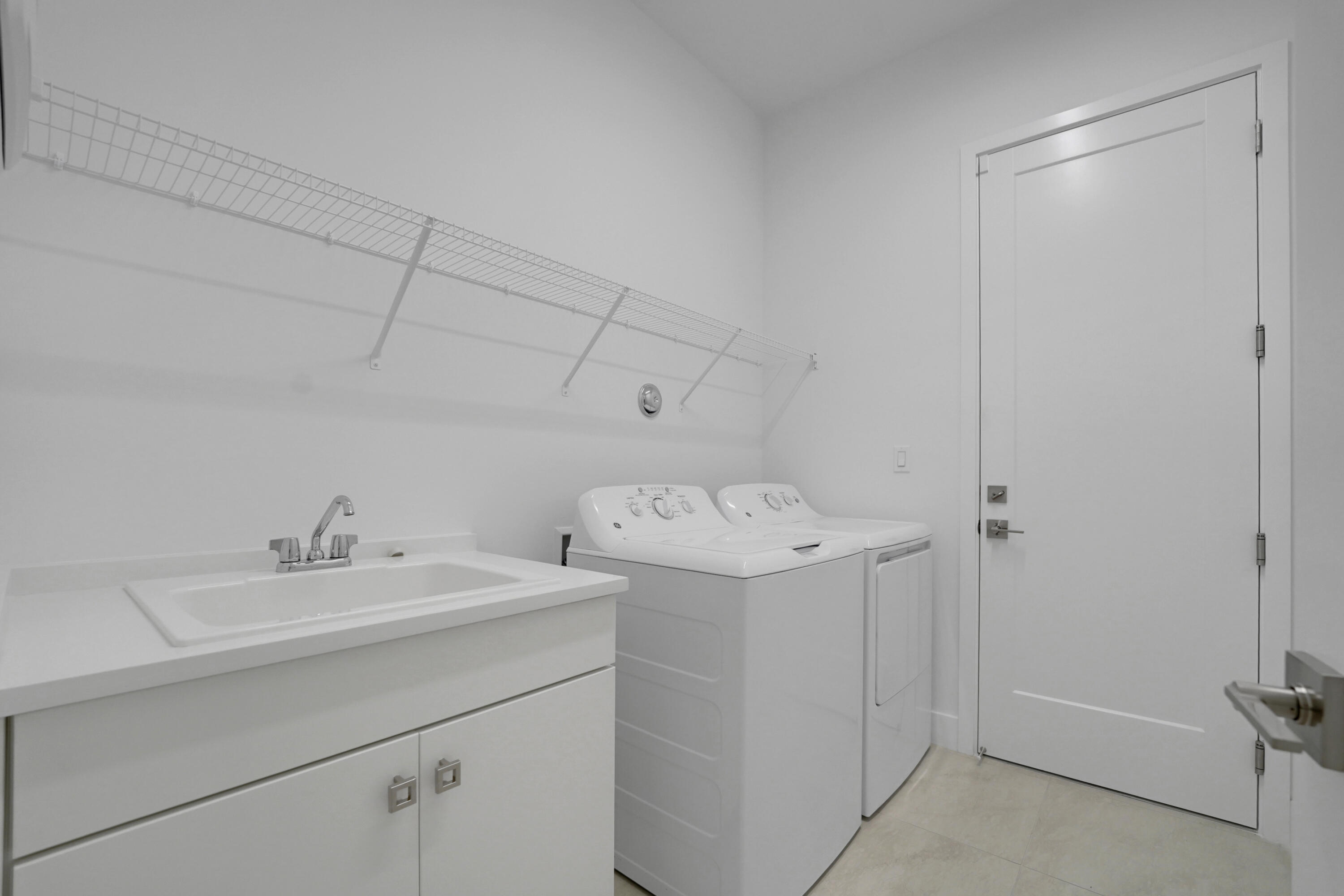 9409 Sunflower Mdw Road Boca Raton, FL 33434 - Photo 56 of 88 Laundry room