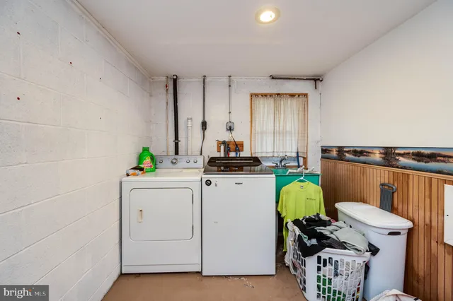 a kitchen with a stove a sink and a refrigerator