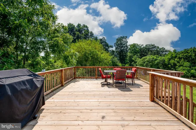 a view of roof deck with chairs