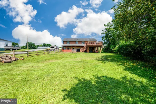 a view of a house with a big yard