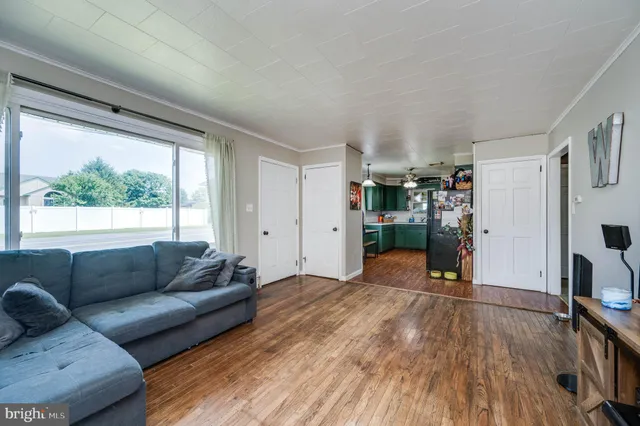 a living room with furniture and a window