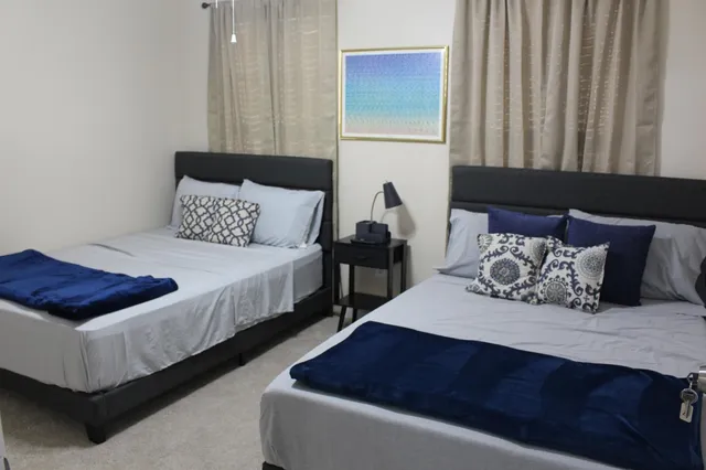 a bedroom with bed and window