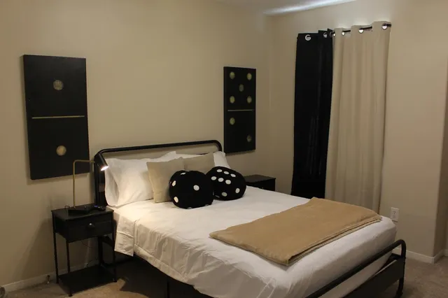 a bedroom with a bed and a closet