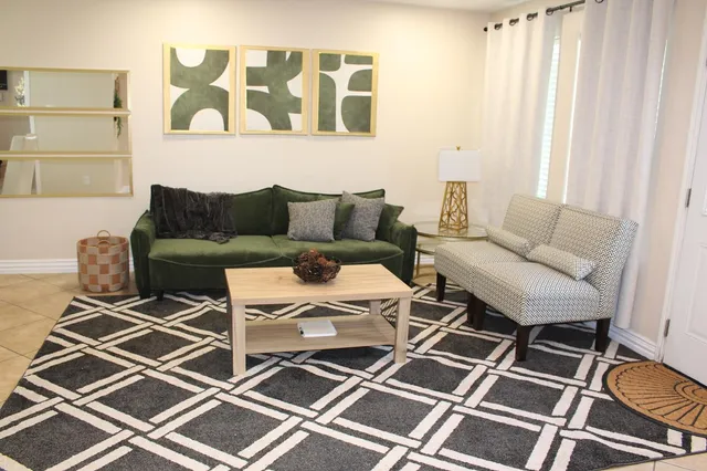 a living room with a couch and a window