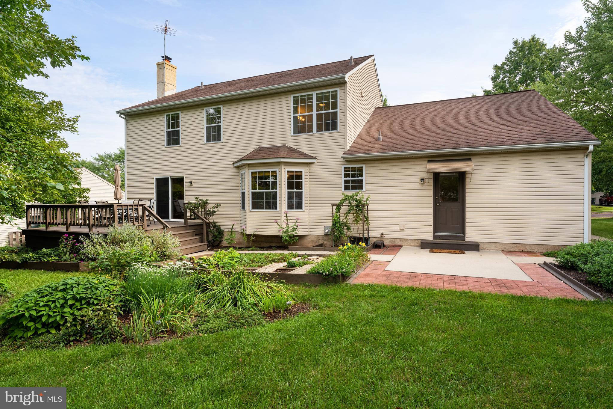 202 Strassburger Road Perkasie, PA 18944 - Photo 4 of 35 Rear deck, patio and garden beds