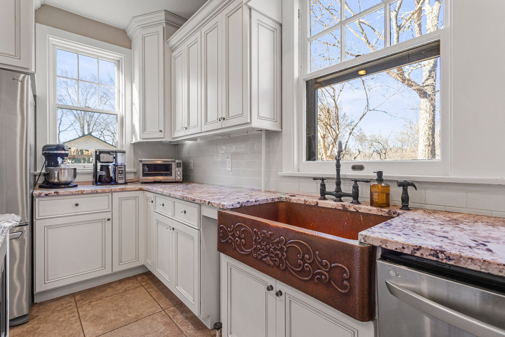 1124 North State Street Monticello, IL 61856 - Photo 20 of 53 a kitchen with granite countertop a sink stainless steel appliances window and cabinets