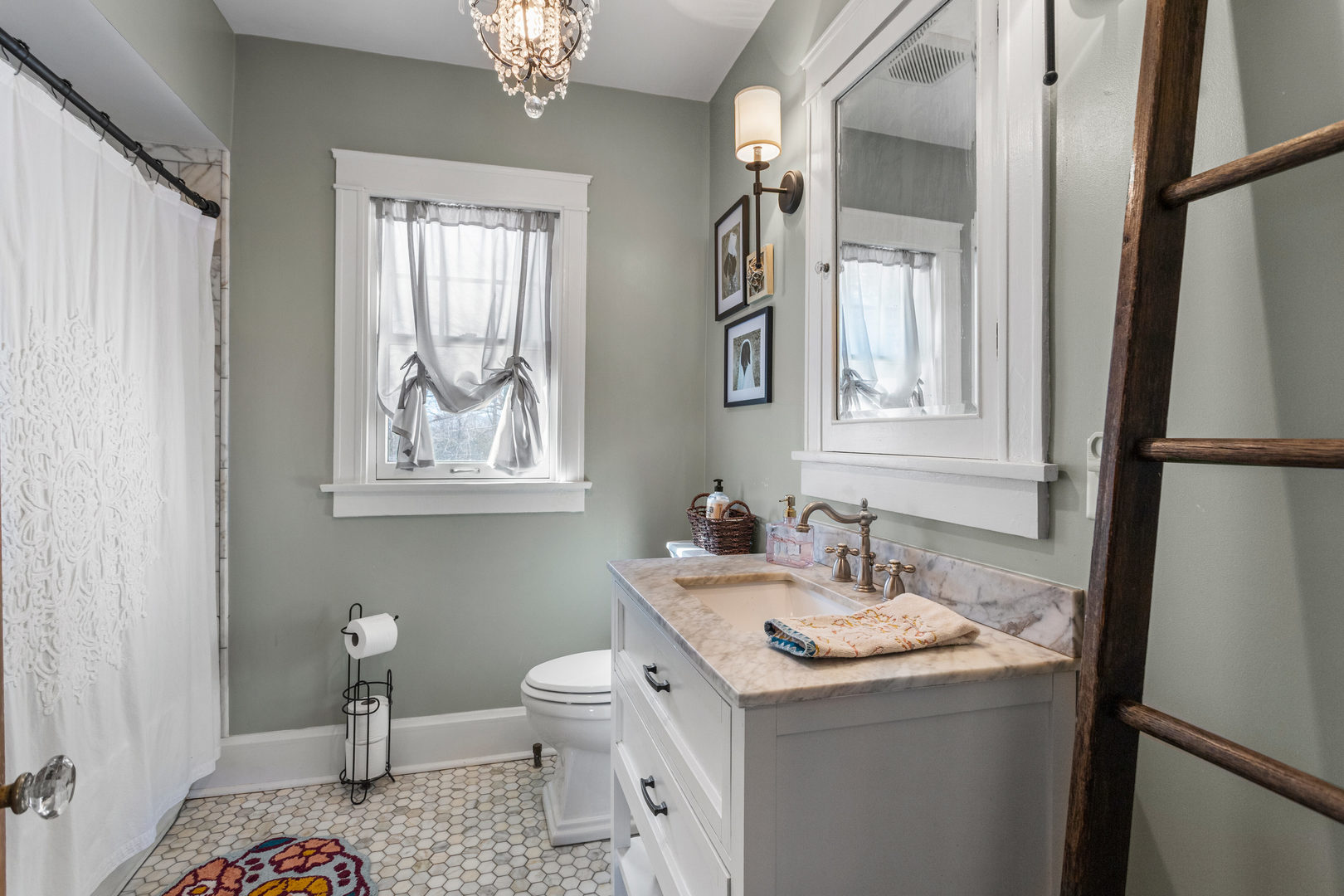 1124 North State Street Monticello, IL 61856 - Photo 35 of 53 a bathroom with a sink a toilet and a mirror