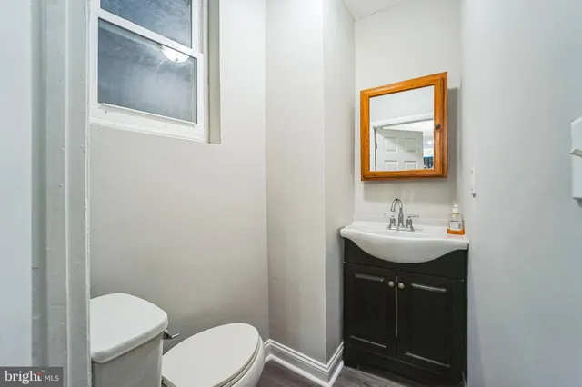 a bathroom with a toilet and a sink