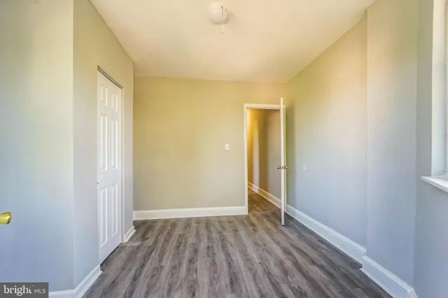 a view of hallway with wooden floor