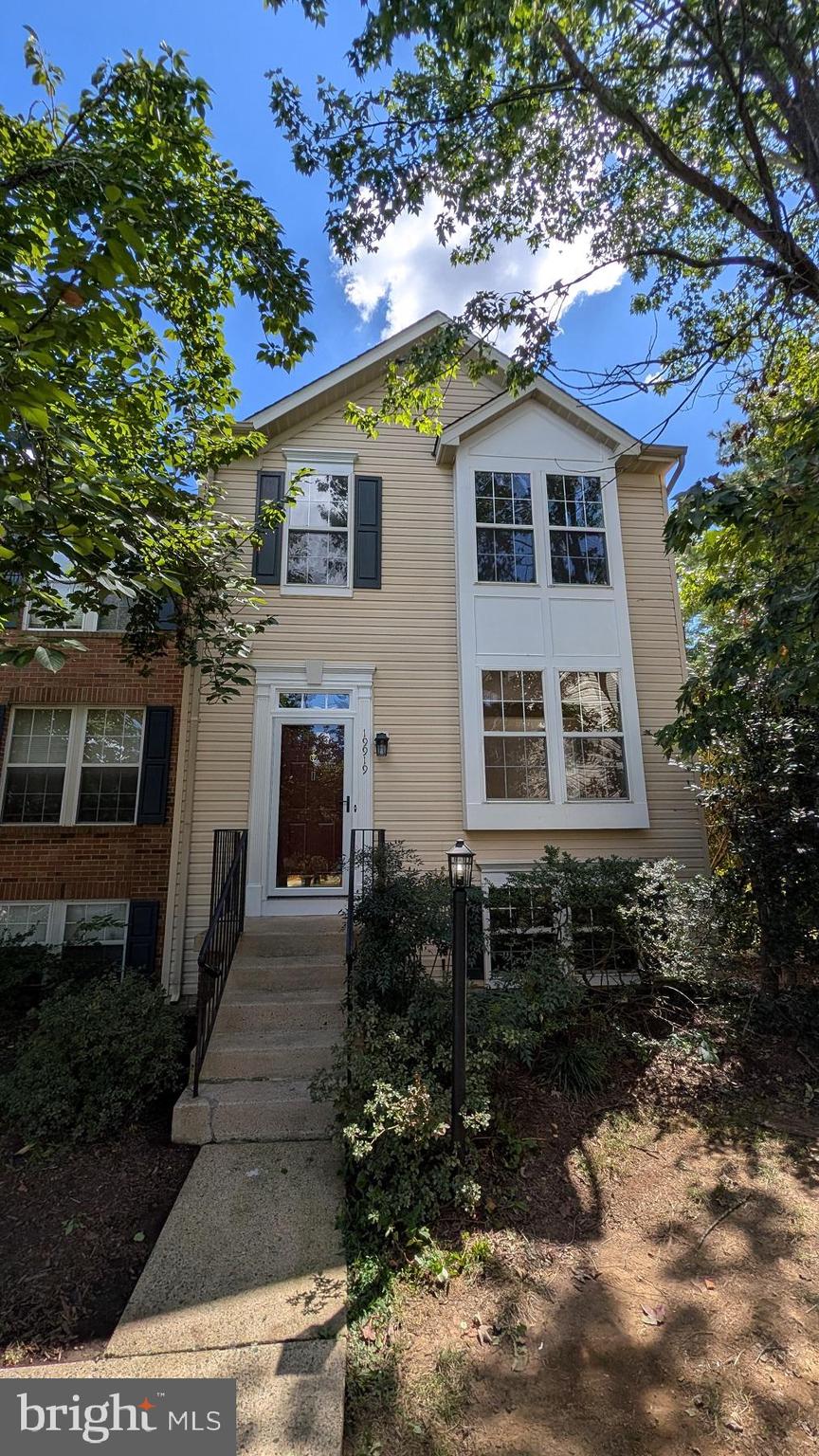 a house that has a tree in front of the house