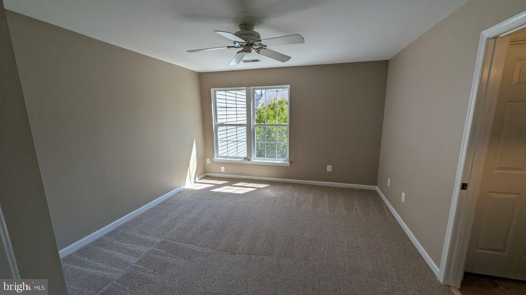 19919 Ridgecrest Square Ashburn, VA 20147 - Photo 12 of 22 a view of an empty room with a window