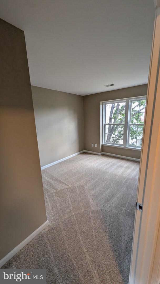 19919 Ridgecrest Square Ashburn, VA 20147 - Photo 15 of 22 an empty room with windows