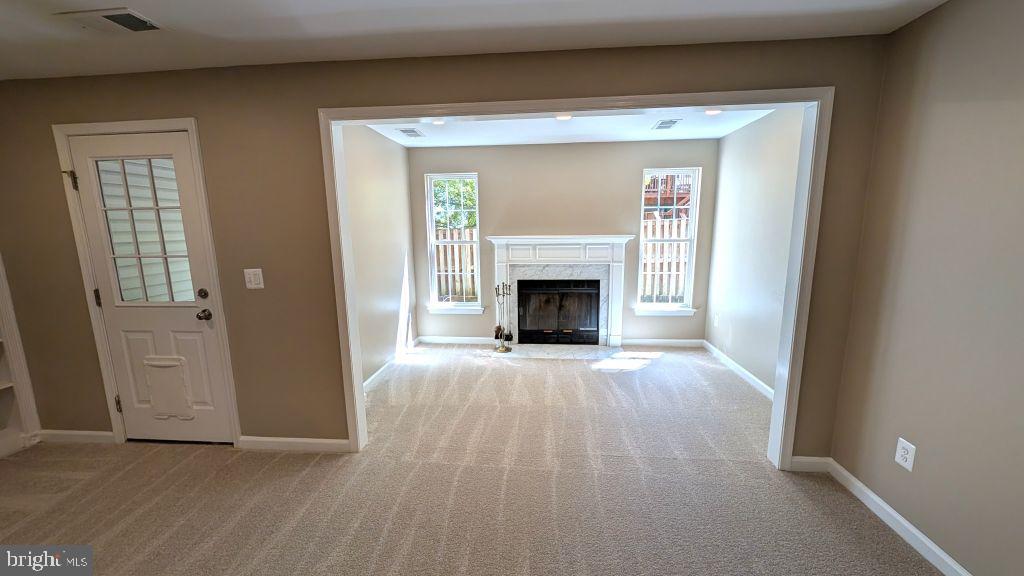 19919 Ridgecrest Square Ashburn, VA 20147 - Photo 19 of 22 a view of empty room with a fireplace and wooden floor