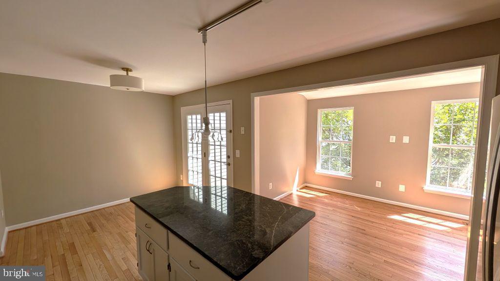 19919 Ridgecrest Square Ashburn, VA 20147 - Photo 10 of 22 a view of a livingroom with a kitchen and a window