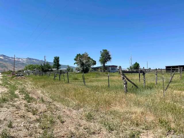 a swimming pool with trees in the background