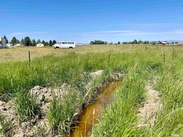 a view of an ocean and a yard