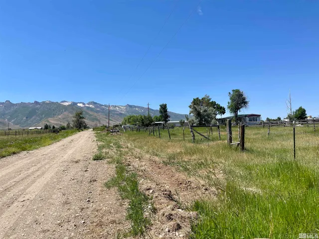 a view of a lake with a house in the background