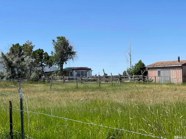 a view of a swimming pool with a yard