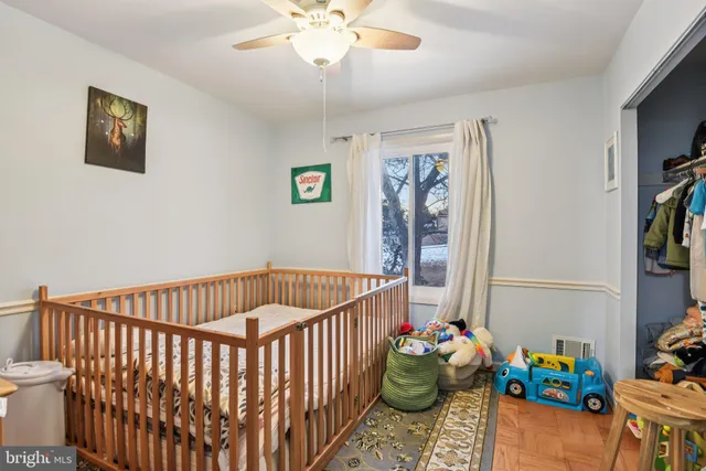 a bedroom with furniture and a chandelier