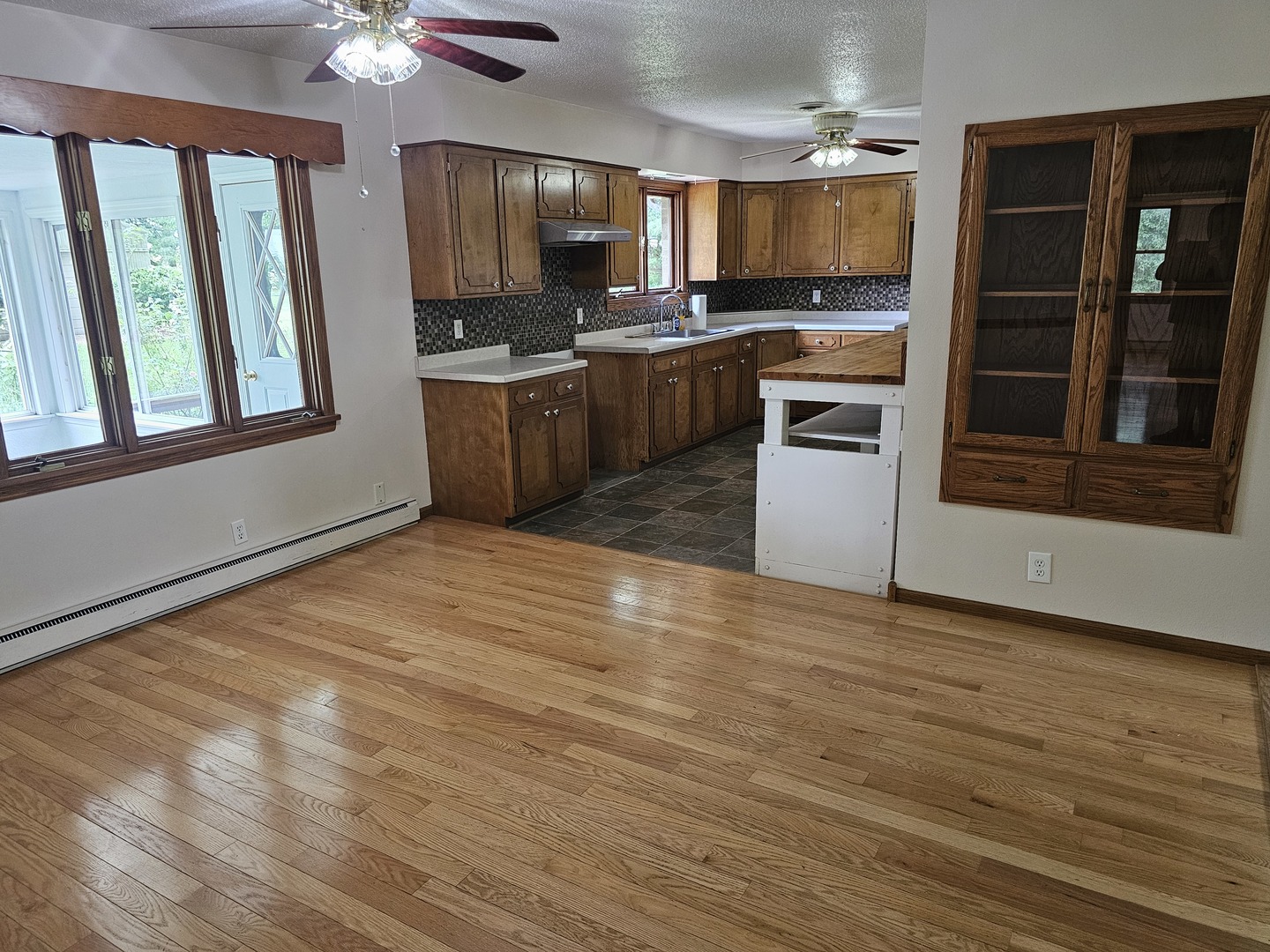 23025 Hazel Road Sterling, IL 61081 - Photo 4 of 29 a kitchen with stainless steel appliances granite countertop a stove a sink and a refrigerator